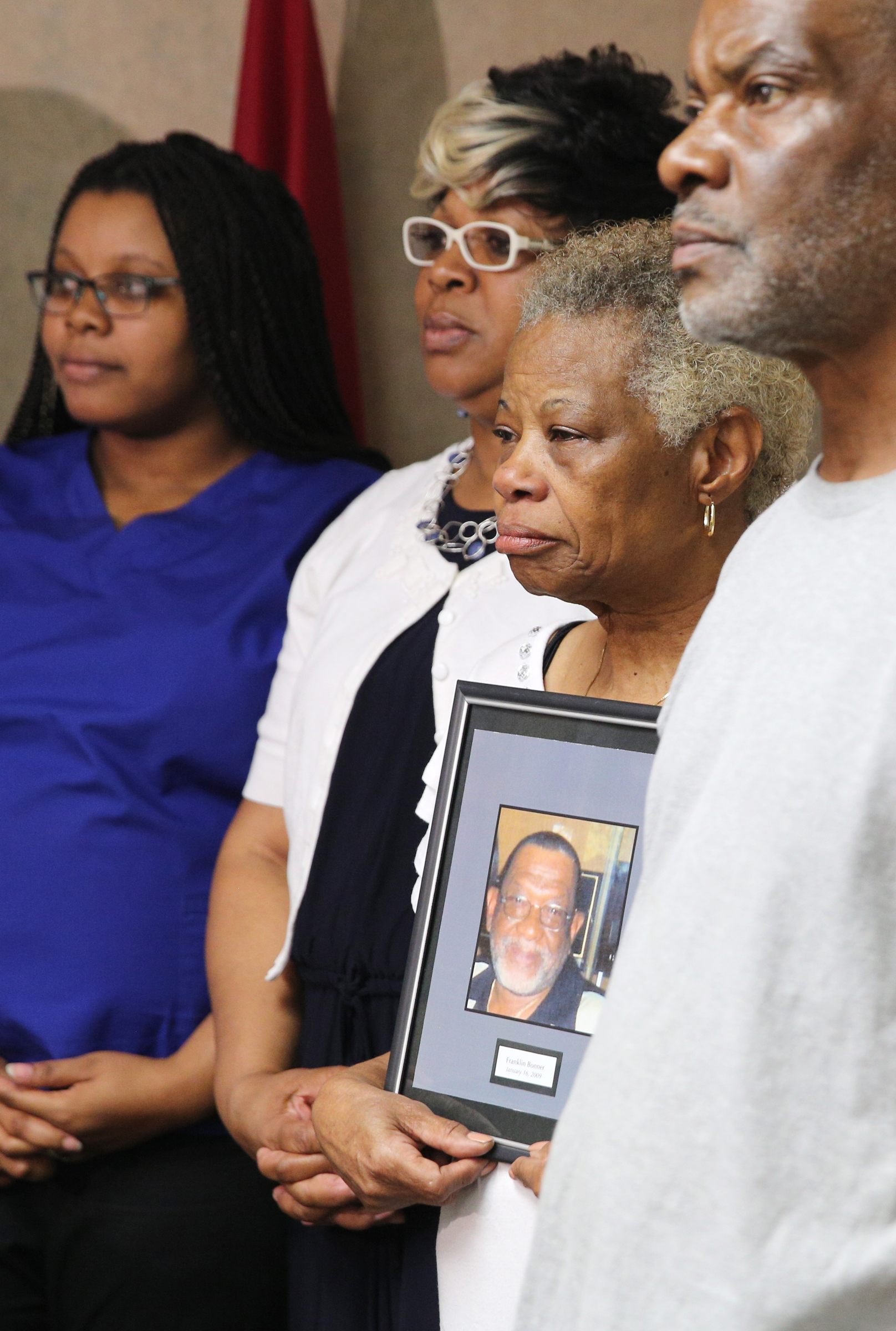 Linda Bonner holds onto a photo of her late husband Franklin Augustus ҋookieӠBonner while surrounded by her granddaughter Ciera Wilkes, daughter Stephanie Penson and son Preston Bonner during a press conference at the Newell Towers Tuesday, June 12, 2018 in Chattanooga, Tennessee. This week the Hamilton County Grand Jury returned indictments of felony murder robbery and especially aggravated robbery against Mallory Aunte Vaughn in the 2009 homicide of Franklin Bonner.