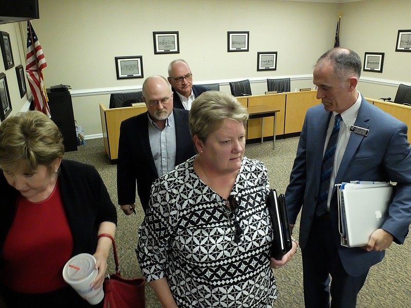 Staff photo by Tim Barber Walker County School Board members exit the meeting room for an executive session in April 2017. The board is still waiting to receive a detailed budget for the upcoming fiscal year.