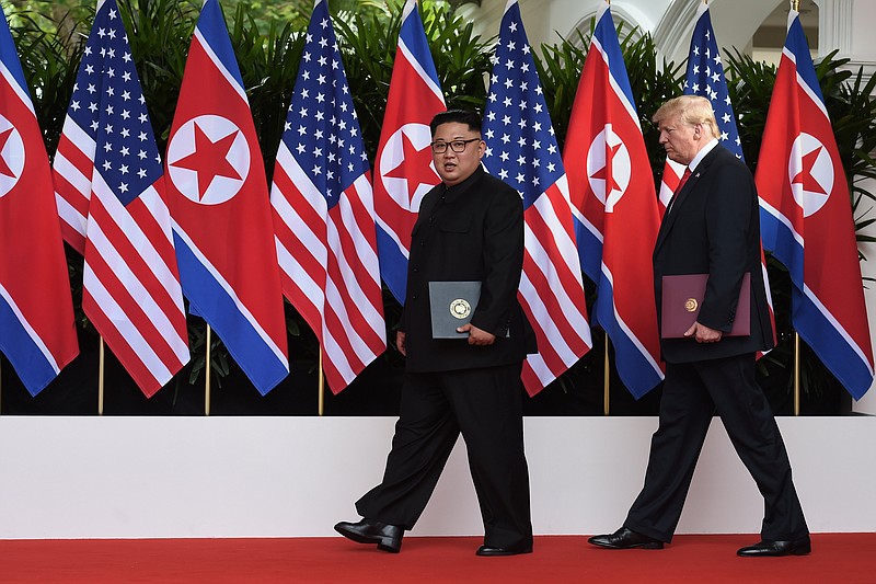 President Donald Trump and Kim Jong Un of North Korea leave a document-signing ceremony in Singapore. (Anthony Wallace/Pool via The New York Times)