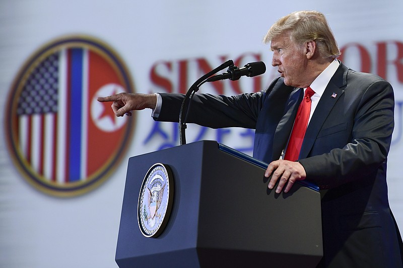 U.S. President Donald Trump answers questions about the summit with North Korea leader Kim Jong Un during a press conference at the Capella resort on Sentosa Island Tuesday, June 12, 2018 in Singapore. (AP Photo/Susan Walsh)

