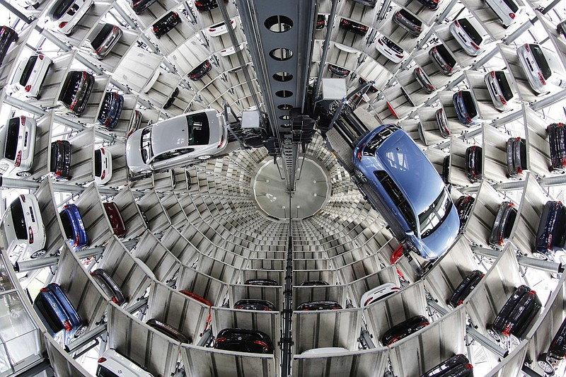FILE - In this April 28, 2016 file photo Volkswagen cars are presented to media inside a delivery tower in Wolfsburg, Germany. Automaker Volkswagen says it's being fined 1 billion euros ($1.18 billion) by German authorities in connection with the diesel emissions scandal. (AP Photo/Markus Schreiber, File)