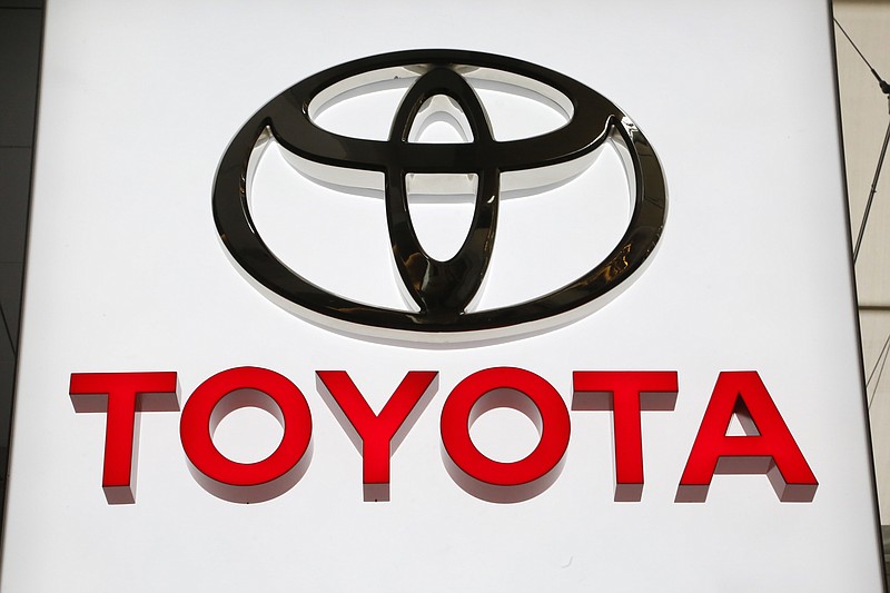 In this Feb. 15, 2018 photo, the Toyota logo is on display at the Pittsburgh Auto Show. Japan's top automaker Toyota Motor Corp. is investing $1 billion in Grab, the leading ride-hailing company in Southeast Asia, the company said Wednesday, June 13, 2018. (AP Photo/Gene J. Puskar)