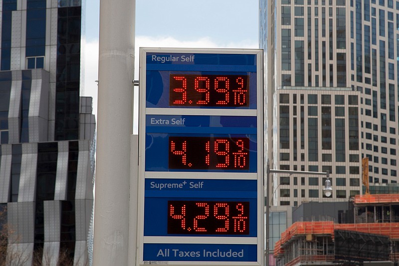 FILE- In this April 18, 2018, file photo, gas prices are displayed at a Mobil station in New York. President Donald Trump is declaring that oil prices are too high and blaming a coalition of countries that control a significant portion of the world's supply of crude petroleum. Trump tweeted on Wednesday: "Oil prices are too high, OPEC is at it again. Not good!" (AP Photo/Mark Lennihan, File)
