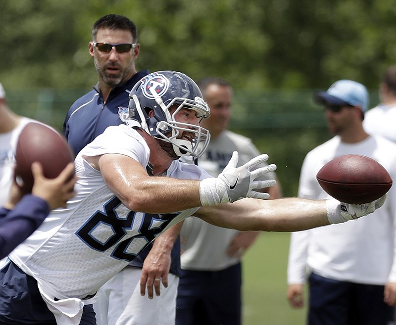 Tight end Luke Stocker makes a catch in front of first-year head coach Mike Vrabel on Tuesday during the Tennessee Titans' minicamp in Nashville.