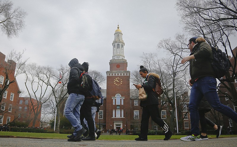 
              FILE - In this Feb. 1, 2017, file photo, Brooklyn College students walk between classes on campus in New York. More than two-thirds of college students at all levels said in a survey that they feel stressed about their personal finances, according The Study on Collegiate Financial Wellness, a 2017 report by The Ohio State University. (AP Photo/Bebeto Matthews, File)
            