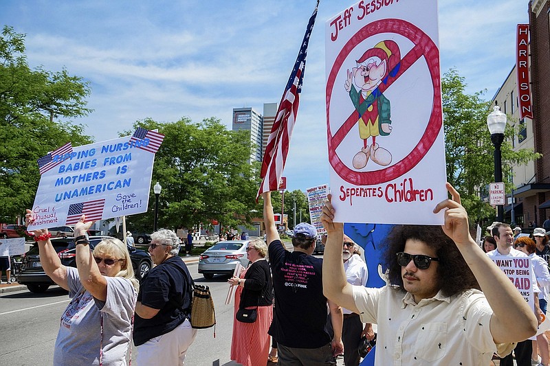 Demonstrators line up to protest U.S. Attorney General Jeff Sessions and immigration reform at Parkview Field in Fort Wayne, Ind. Thursday, June 14, 2018. (Mike Moore/The Journal-Gazette via AP)


