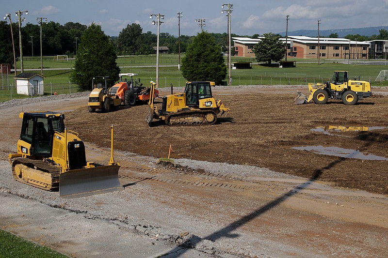Construction proceeds on the Hixson High School track on Tuesday, June 12, 2018, in Chattanooga, Tenn. 