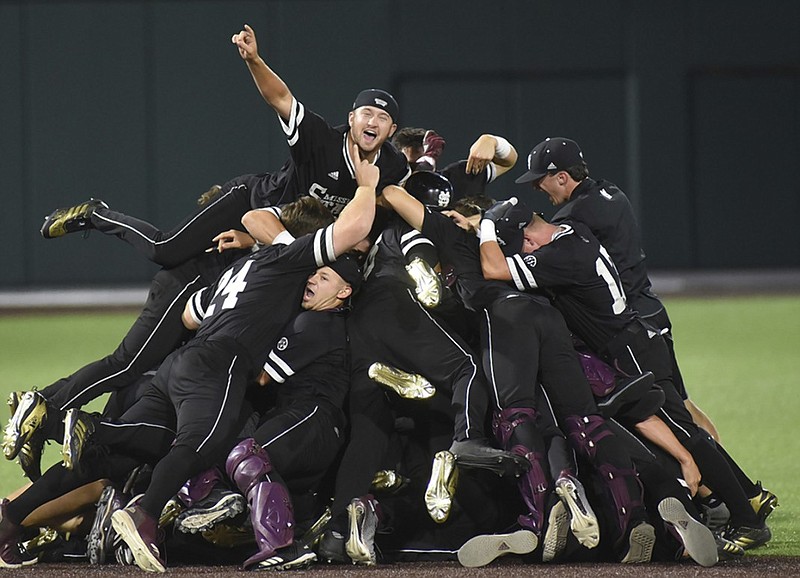 Mississippi State baseball players celebrate after beating Vanderbilt 10-6 to win an NCAA super regional Monday in Nashville. The Bulldogs are in the College World Series, which starts today, after starting the season 14-15.