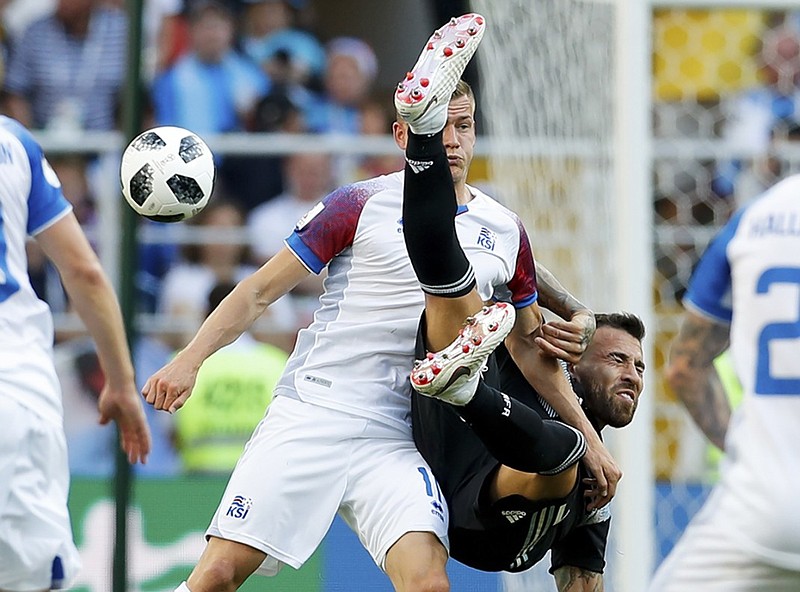 Iceland's Alfred Finnbogason, left, and Argentina's Nicolas Otamendi compete for the ball during their World Cup match Saturday at Spartak Stadium in Moscow.