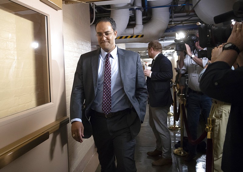 Rep. Will Hurd, R-Texas, whose congressional district runs along the majority of Texas's border with Mexico, arrives for a closed-door GOP meeting in the basement of the Capitol as the Republican leadership tries to reach a policy agreement between conservatives and moderates on immigration, in Washington, Thursday, June 7, 2018.