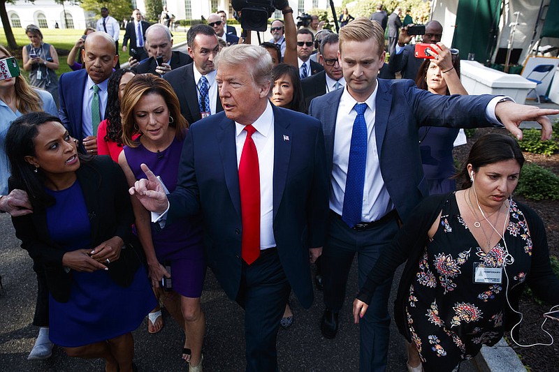 President Donald Trump speaks to reporters at the White House, Friday, June 15, 2018, in Washington.