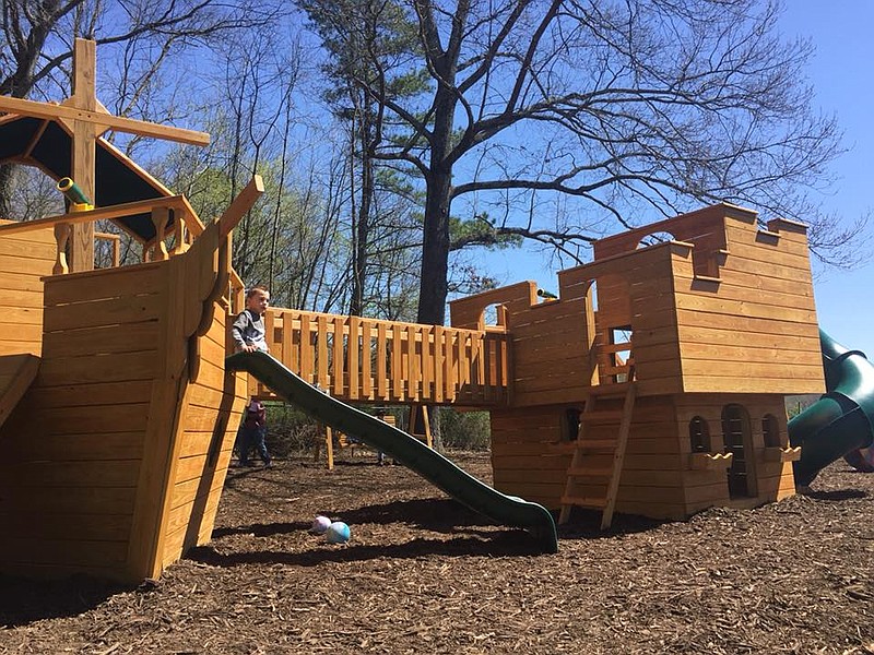 A child plays on the slide at Little Kingdom Academy in Flintstone, Ga. The new day care has plenty of activities to keep kids busy. (Contributed photo)