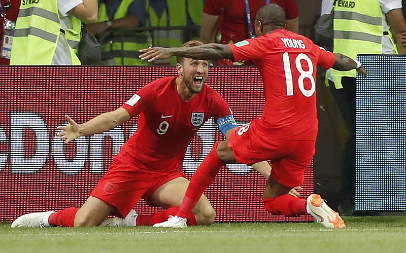 
              England's Harry Kane, left, celebrates his winning goal with England's Ashley Young during the group G match between Tunisia and England at the 2018 soccer World Cup in the Volgograd Arena in Volgograd, Russia, Monday, June 18, 2018. (AP Photo/Frank Augstein)
            