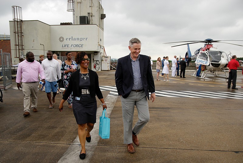 Blake Freeman, right, and Howard principal Leandrea Ware walk across the Life Force helipad during a tour at Erlanger Hospital on Wednesday, June 13, 2018, in Chattanooga, Tenn. Teachers from Howard and other schools which will launch Future Ready Institutes in the fall spent the week participating in externships at business partners across the region.