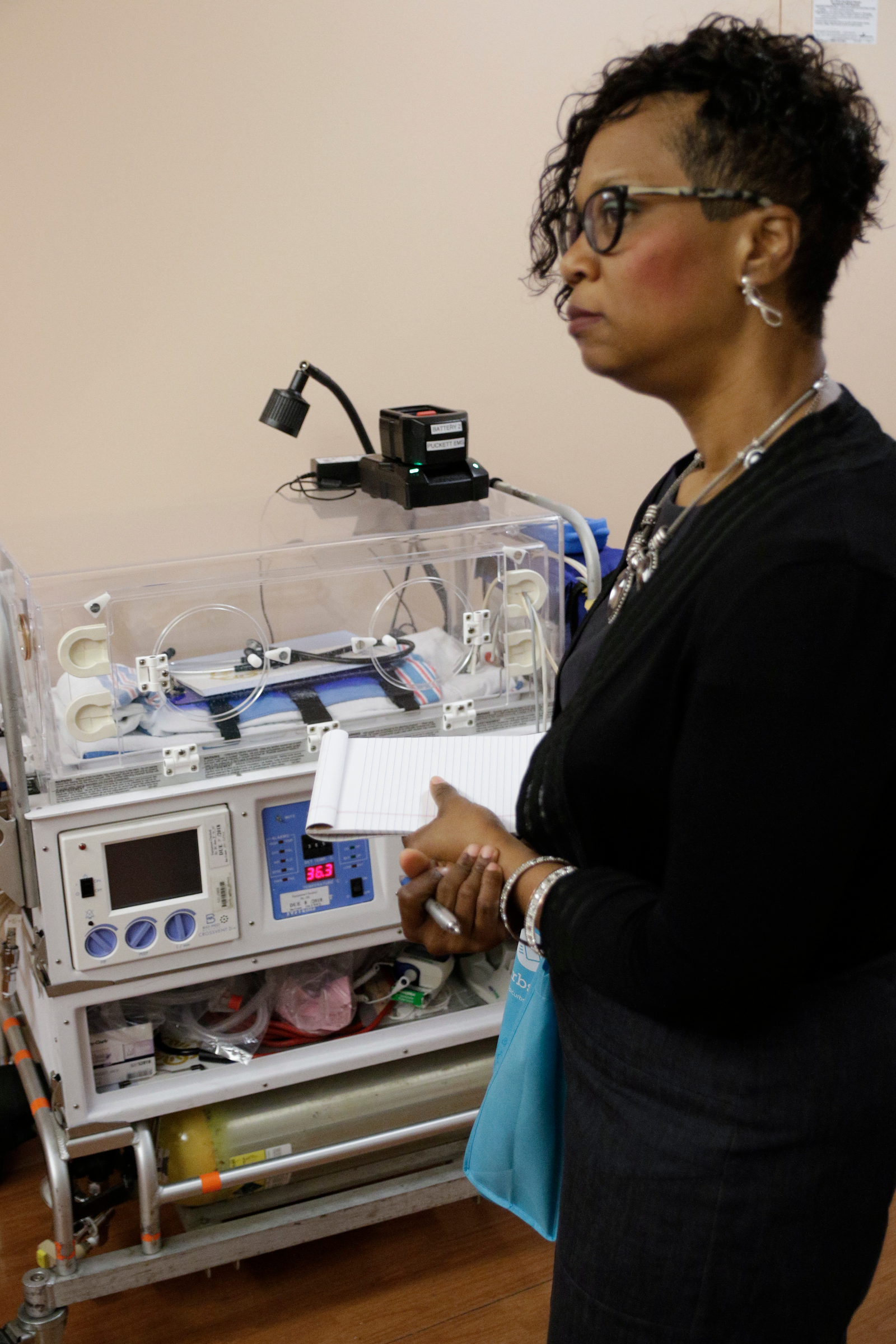 Howard principal Leandrea Ware stands next to a NICU machine at Erlanger Hospital during a tour on Wednesday, June 13, 2018, in Chattanooga, Tenn. Teachers from Howard and other schools which will launch Future Ready Institutes in the fall spent the week participating in externships at business partners across the region.