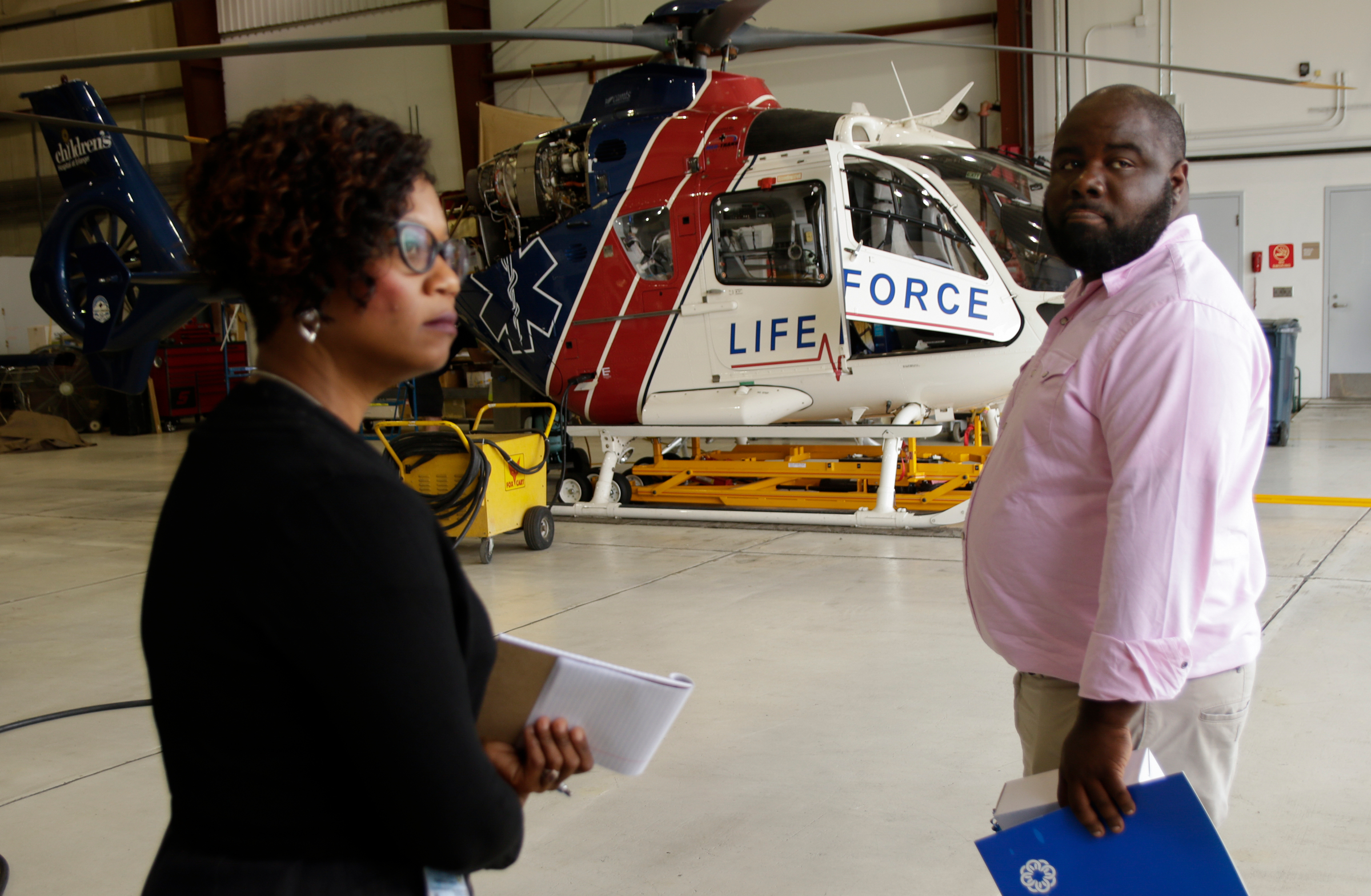 Howard educators Leandrea Ware, left, and James Talley tour the Life Force helipad at Erlanger Hospital on Wednesday, June 13, 2018, in Chattanooga, Tenn. Teachers from Howard and other schools which will launch Future Ready Institutes in the fall spent the week participating in externships at business partners across the region.