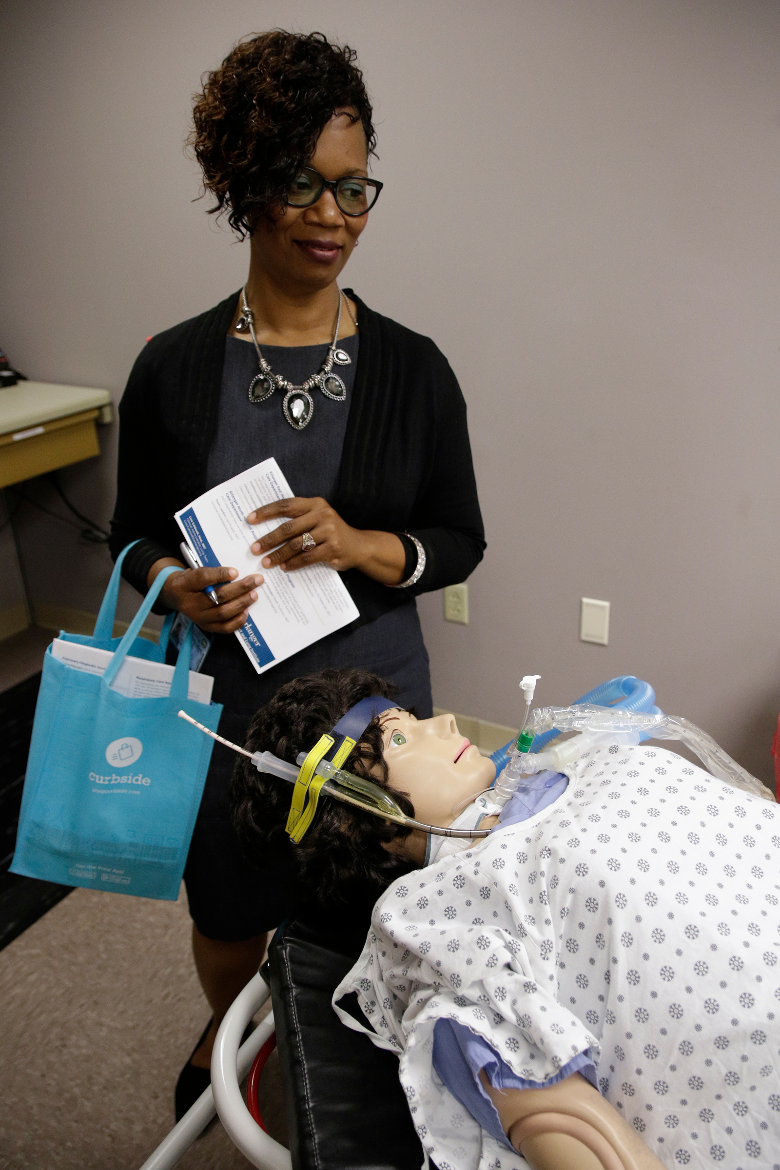Howard principal Leandrea Ware looks at a respiratory therapy dummy during a tour at Erlanger Hospital on Wednesday, June 13, 2018, in Chattanooga, Tenn. Teachers from Howard and other schools which will launch Future Ready Institutes in the fall spent the week participating in externships at business partners across the region.