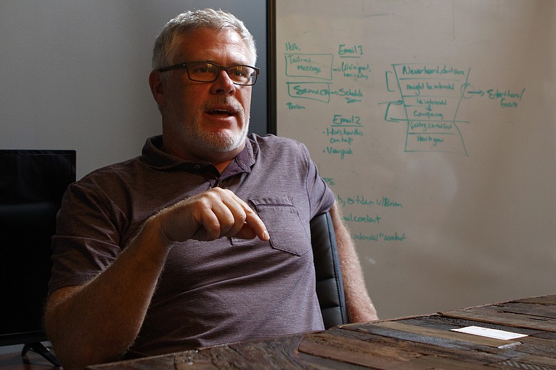 Co-founder Brian Elrod speaks with the Times Free Press at the Text Request office on Monday, June 4, 2018 in Chattanooga, Tenn.