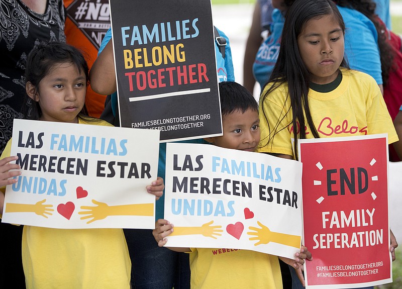 Children hold signs during a demonstration in front of the Immigration and Customs Enforcement offices in Miramar, Florida, protesting the Trump administration's move to separate immigrant parents from their children on the U.S.-Mexico border.