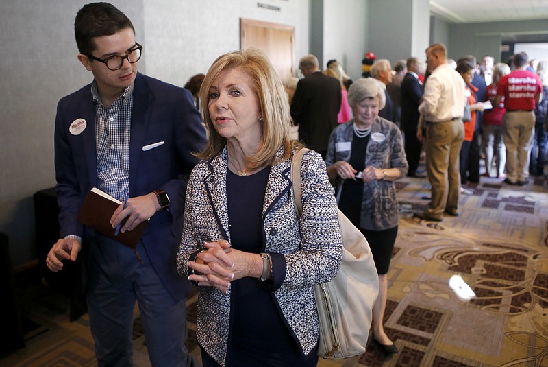 United States Senate candidate Marsha Blackburn, center, makes her way down the hall during the Hamilton County Republican Party's annual Lincoln Day Dinner at The Chattanoogan on Friday, April 27, 2018 in Chattanooga, Tenn.