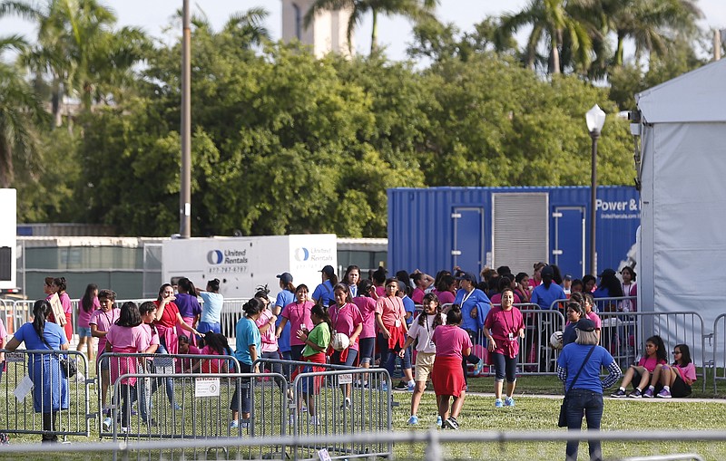 Immigrant children play outside a former Job Corps site that now houses them, Monday, June 18, 2018, in Homestead, Fla.