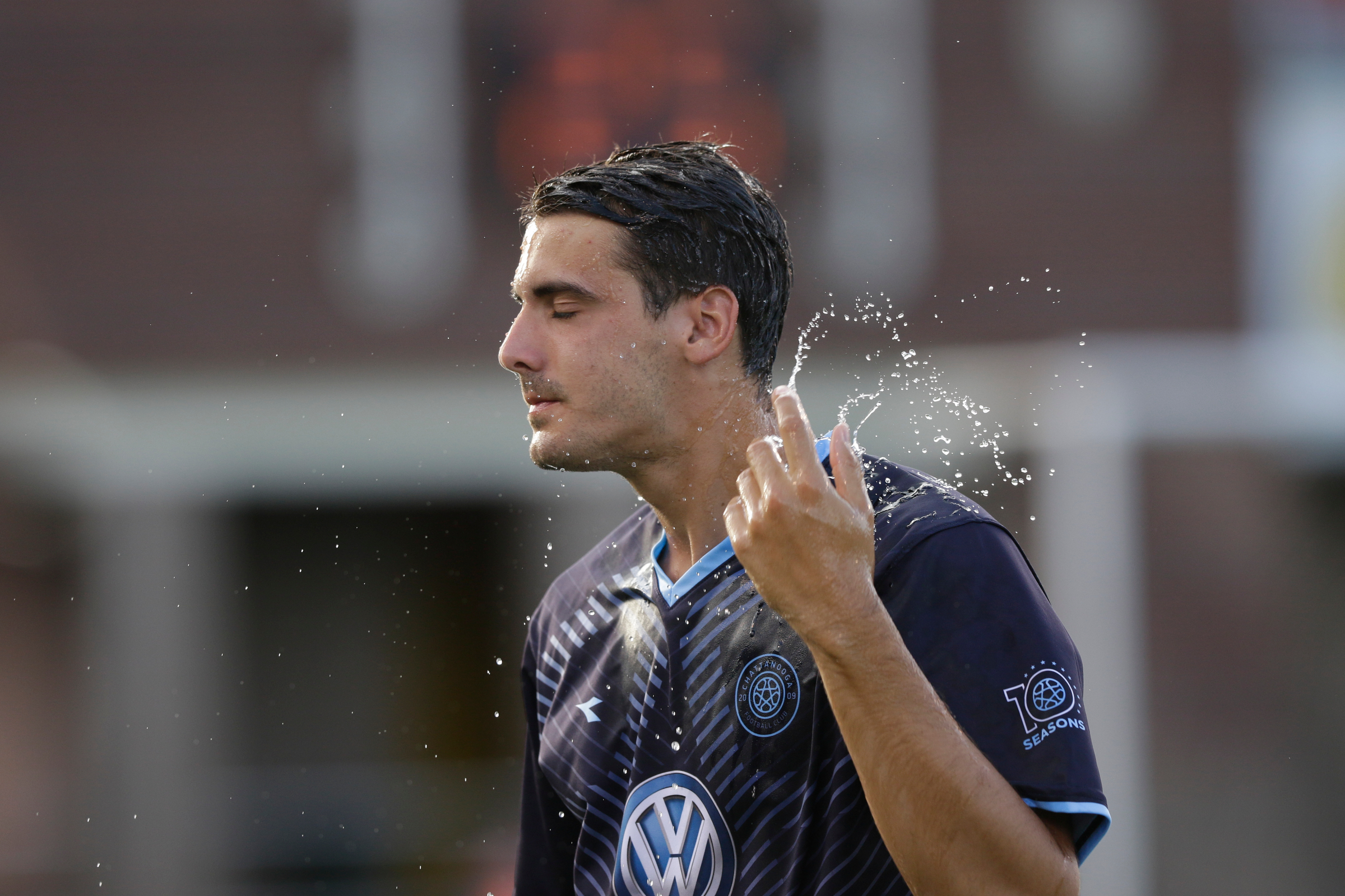 CFC's Juan Sanchez cools off with water before Chattanooga FC's soccer match against the Atlanta Silverbacks at Finley Stadium on Wednesday, June 20, 2018, in Chattanooga, Tenn.