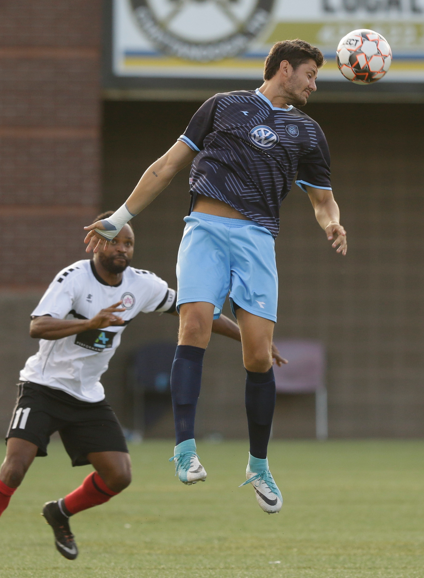 CFC's Daniel Valenciano heads the ball over Atlanta's Sheriff Suma during Chattanooga FC's soccer match against the Atlanta Silverbacks at Finley Stadium on Wednesday, June 20, 2018, in Chattanooga, Tenn.