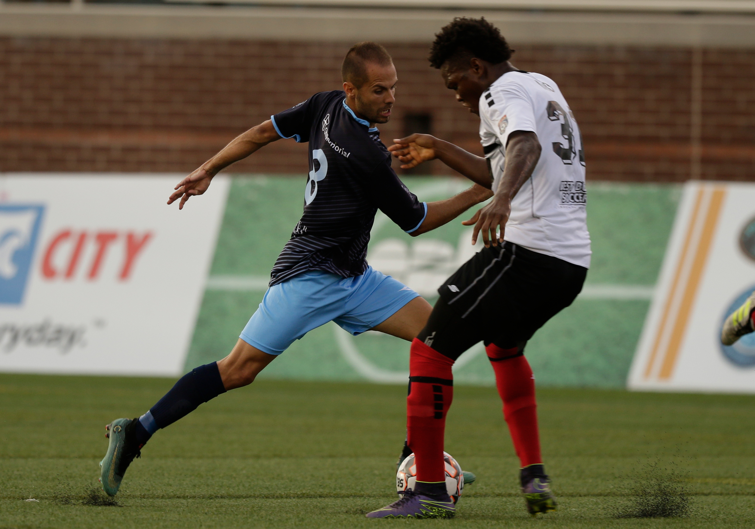 Chattanooga FC's Joao Costa tries to get past the Atlanta Silverbacks' Kevin Issahaku during their NPSL Southeast Conference match Wednesday night at Finley Stadium. CFC scored four goals in a 15-minute span in the second half to win 4-1.