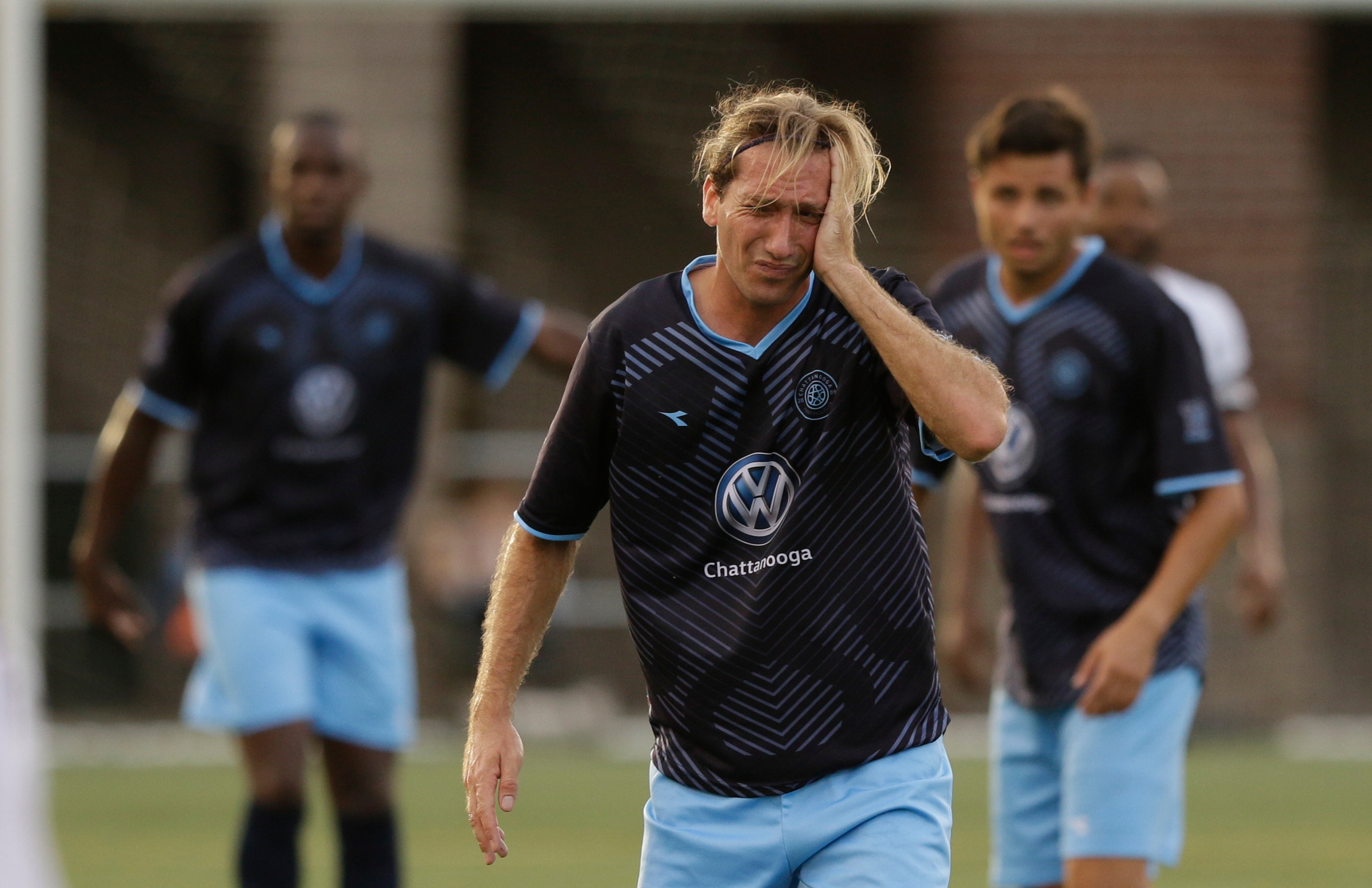 Juan Hernandez Mendizibal grabs his head after a header with an Atlanta player during Chattanooga FC's soccer match against the Atlanta Silverbacks at Finley Stadium on Wednesday, June 20, 2018, in Chattanooga, Tenn.