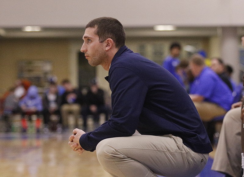 Hamilton Heights basketball coach Zach Ferrell watches a Hawks game in February 2017 at McCallie.