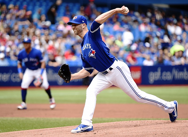 Toronto Blue Jays starting pitcher J.A. Happ delivers to the plate against the Atlanta Braves during the first inning of Wednesday's game in Toronto.