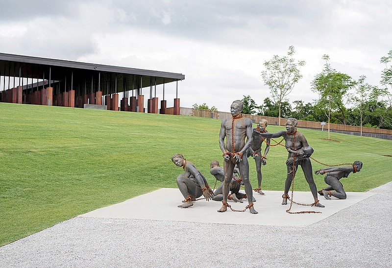 A sculpture by Ghanaian artist Kwame Akoto-Bamfo titled "Nkyinkimsits" sits at the entrance of the National Memorial for Peace and Justice in downtown Montgomery, Ala.