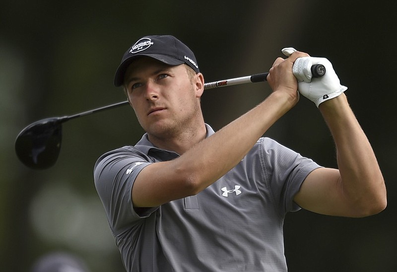 Jordan Spieth tees off on the 18th hole at TPC River Highlands during the first round of the Travelers Championship on Thursday in Cromwell, Conn. Spieth shot a 7-under-par 63 and shared the lead with Zach Johnson.