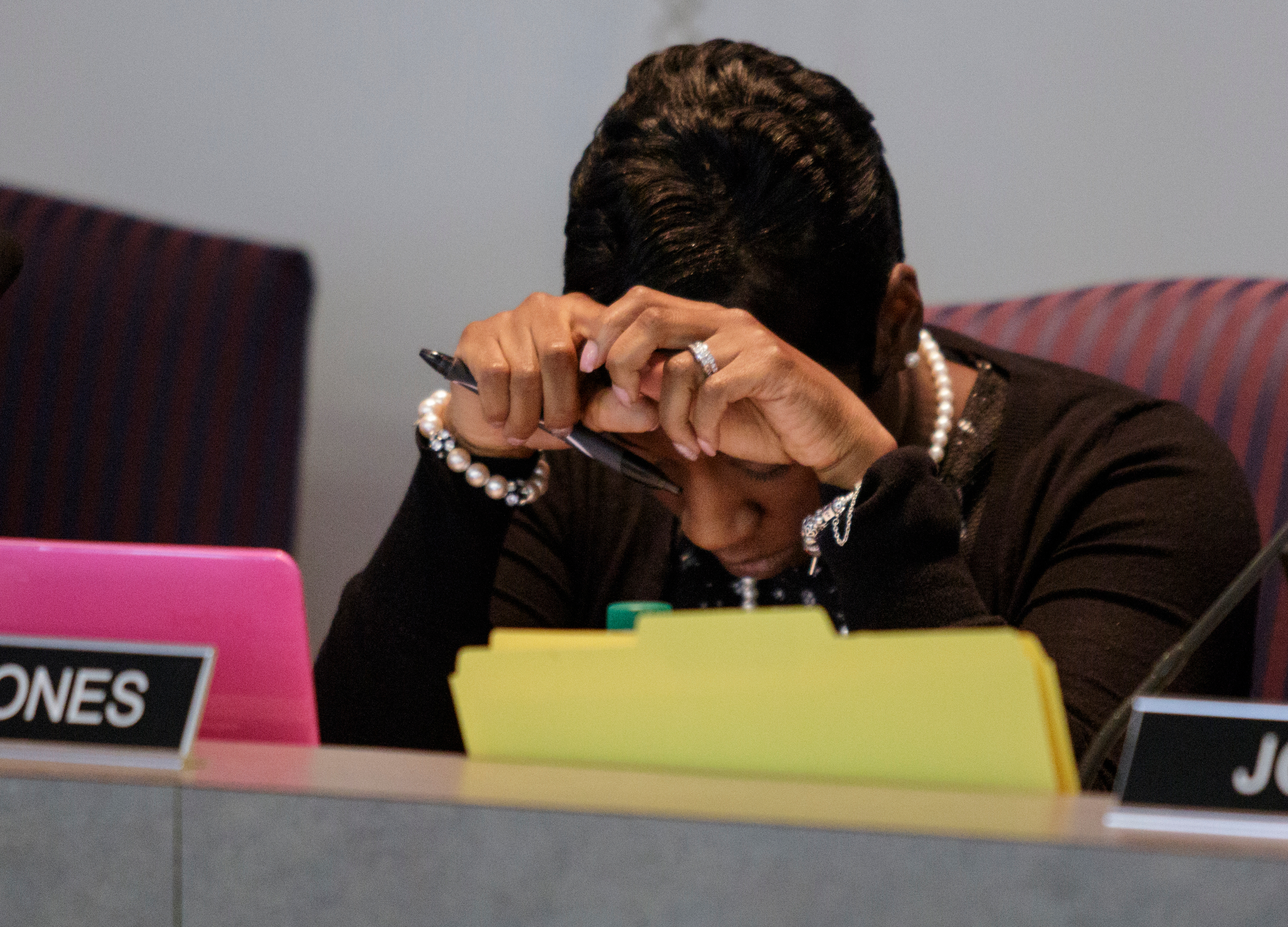 Board member Karitsa Mosley Jones puts her head in her hands as equity in the school system is discussed during a Hamilton County Board of Education work session on Thursday, June 21, 2018, in Chattanooga, Tenn.