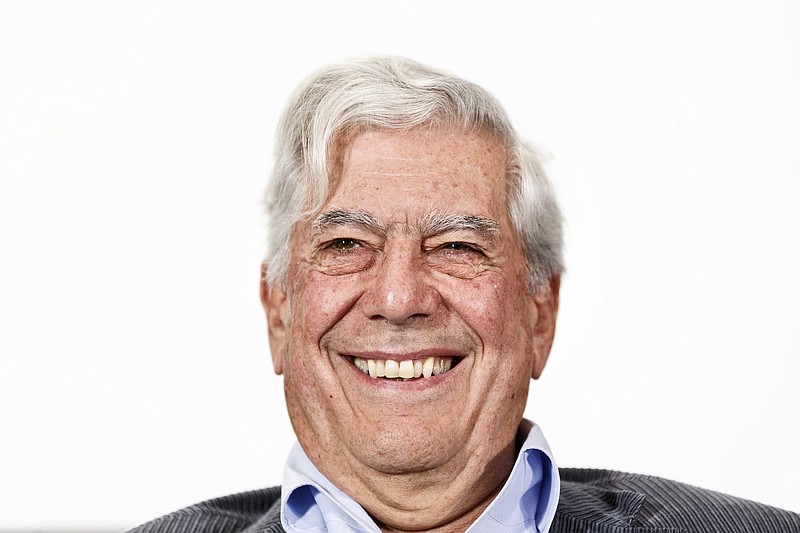 
              FILE - In this April 24, 2013 file photo, Peruvian writer and Nobel Prize winner in literature Mario Vargas Llosa smiles during a press conference at the presentation of a new theater play in Madrid, Spain. Vargas Llosa is under observation, Thursday, June 21, 2018,  at a Madrid hospital after sustaining light injuries in a fall at home. (AP Photo/Daniel Ochoa de Olza, File)
            