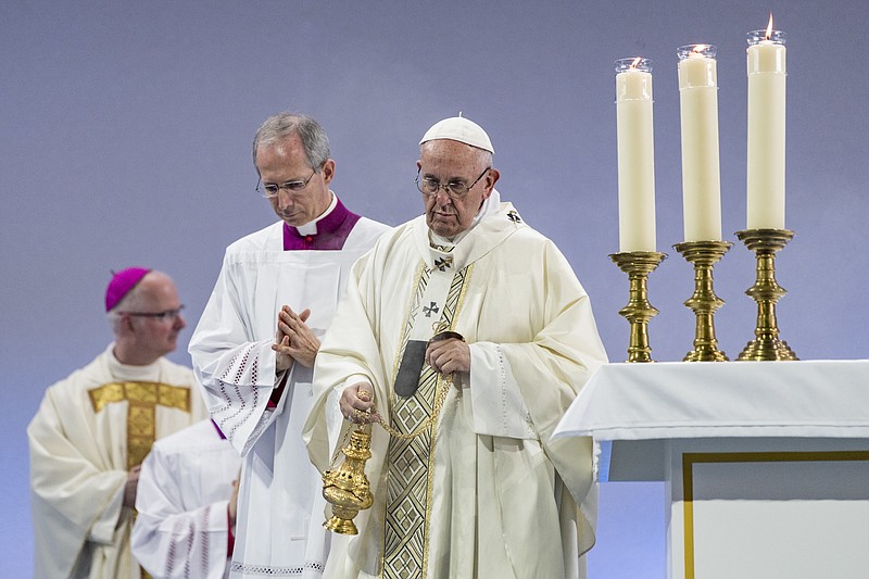 Pope Francis celebrates the Holy Mass at Palexpo hall in Geneva, Switzerland, Thursday, June 21, 2018. Pope Francis visits the World Council of Churches as centerpiece of the ecumenical commemoration of the WCC's 70th anniversary. (Martial Trezzini/pool photo via AP)