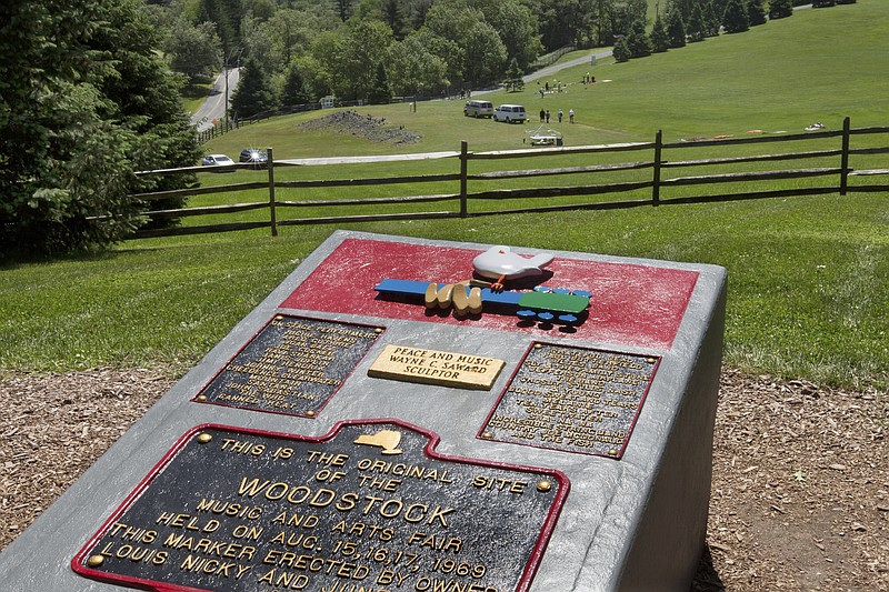 In this June 14, 2018 photo, members of the Public Archaeology Facility at Binghamton University work at the site of the 1969 original Woodstock Music and Art Fair, in Bethel, N.Y. Information from the dig will help a museum plan interpretive walking routes in time for the concert’s 50th anniversary next year. (AP Photo/Richard Drew)