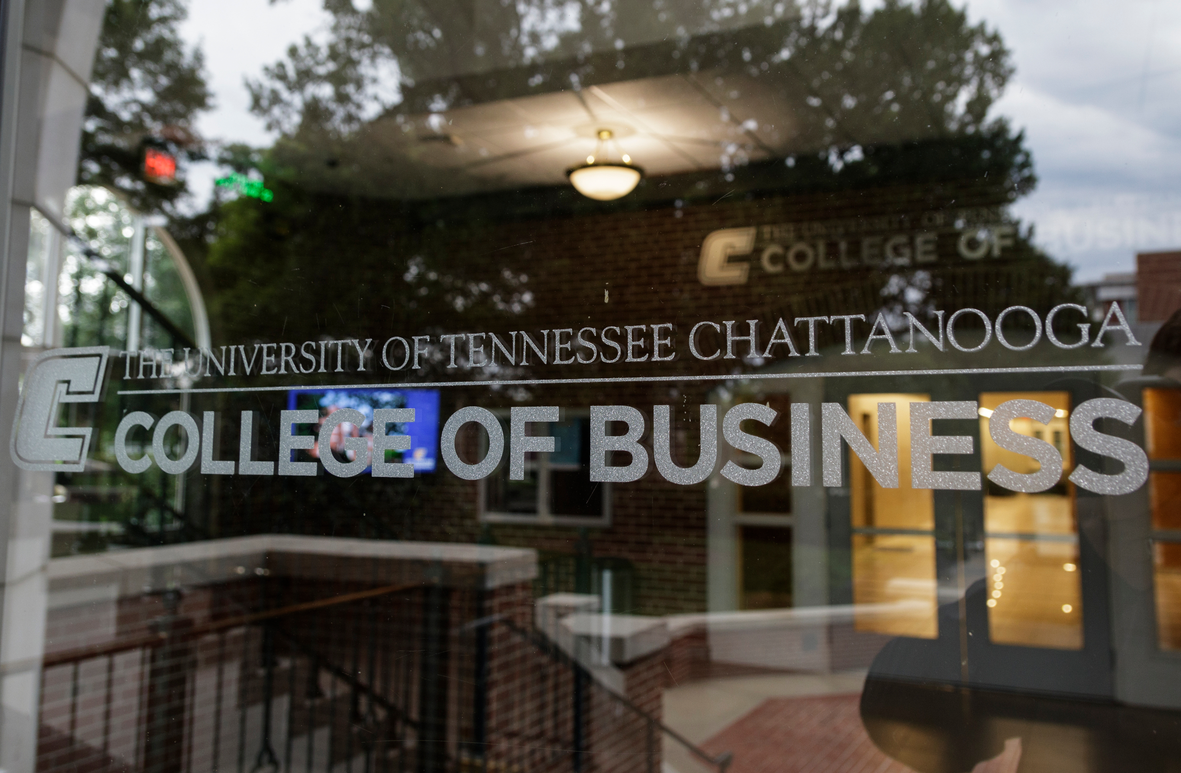 A sign on the door of Fletcher Hall, which houses the newly renamed Gary W. Rollins College of Business, is seen on the campus of the University of Tennessee at Chattanooga on Friday, June 22, 2018, in Chattanooga, Tenn. The college was renamed from the UTC College of Business following an historic $40 million donation, the largest in the university's history, by Gary W. Rollins and Kathleen Rollins.