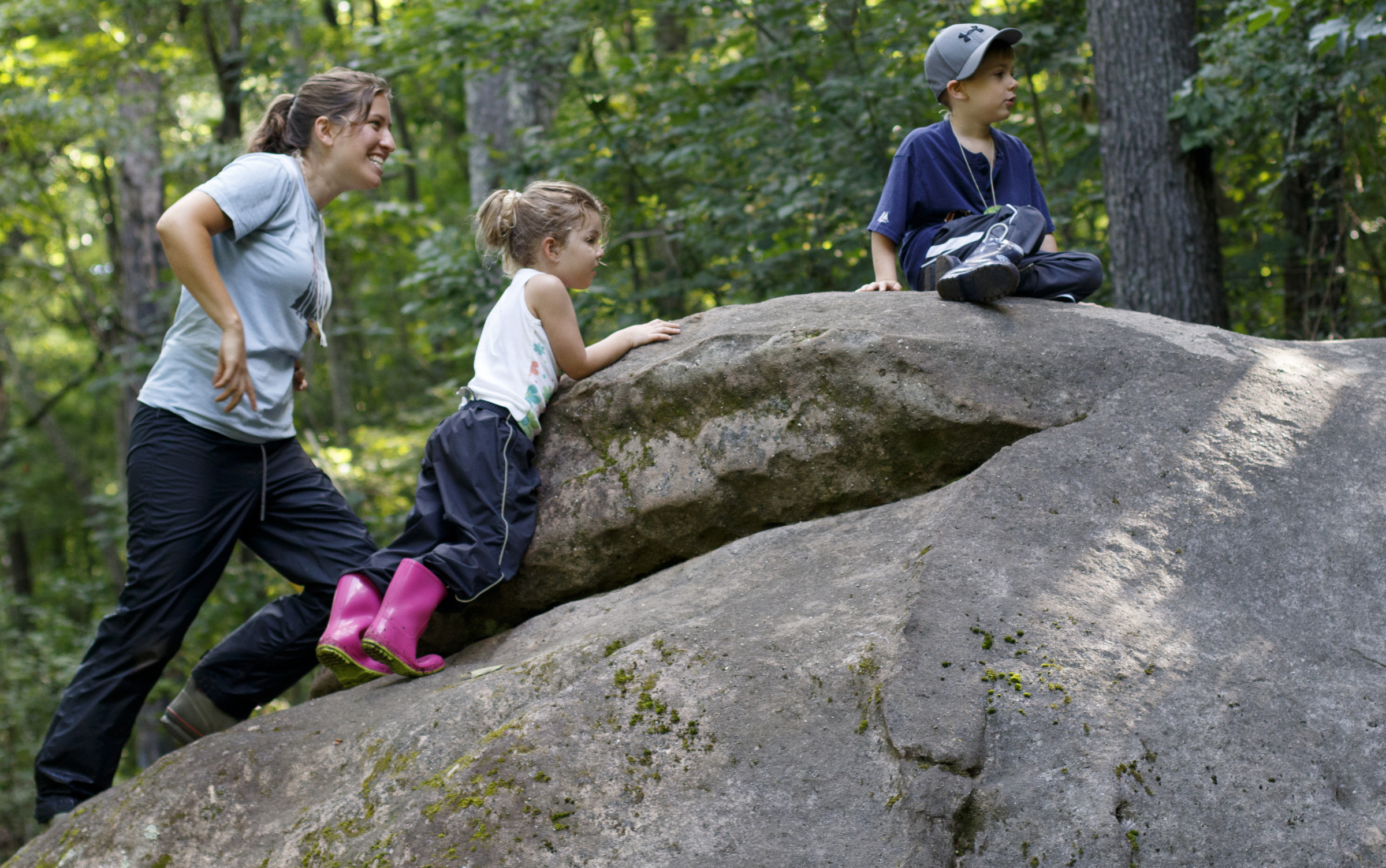 Counselor Rosie Garber, left, plays with Zoe and Luke during a German language immersion camp, part of the Wauhatchie's Forest School School Summer Camp, at Reflection Riding Arboretum and Nature Center on Friday, June 22, 2018 in Chattanooga, Tenn.