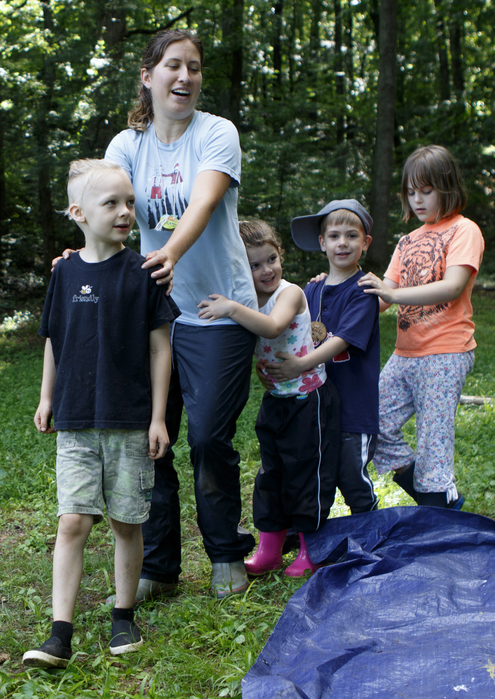 Counselor Rosie Garber follows camper Alvin, as fellow campers Zoe, Luke and Maggie Lu follow her as they sing and dance during a German language immersion camp, part of the Wauhatchie's Forest School School Summer Camp, at Reflection Riding Arboretum and Nature Center on Friday, June 22, 2018 in Chattanooga, Tenn.