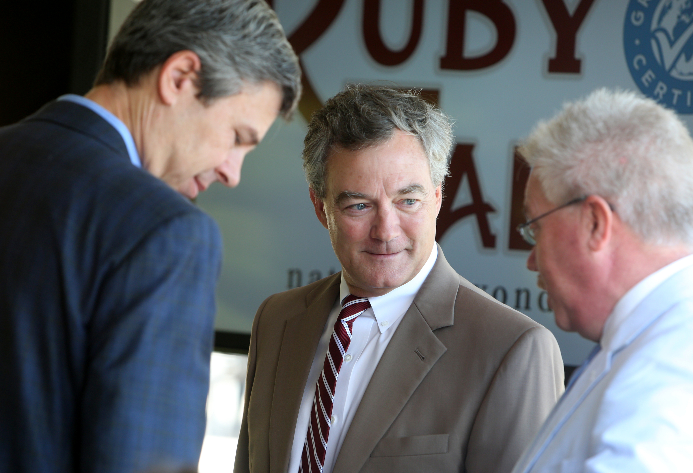 Chattanooga Mayor Andy Berke, Ruby Falls President Hugh Morrow, and Tennessee Commissioner of Tourism and Development Kevin Triplett talk before an unveiling ceremony at Ruby Falls Friday, June 22, 2018 on Lookout Mountain in Tennessee.