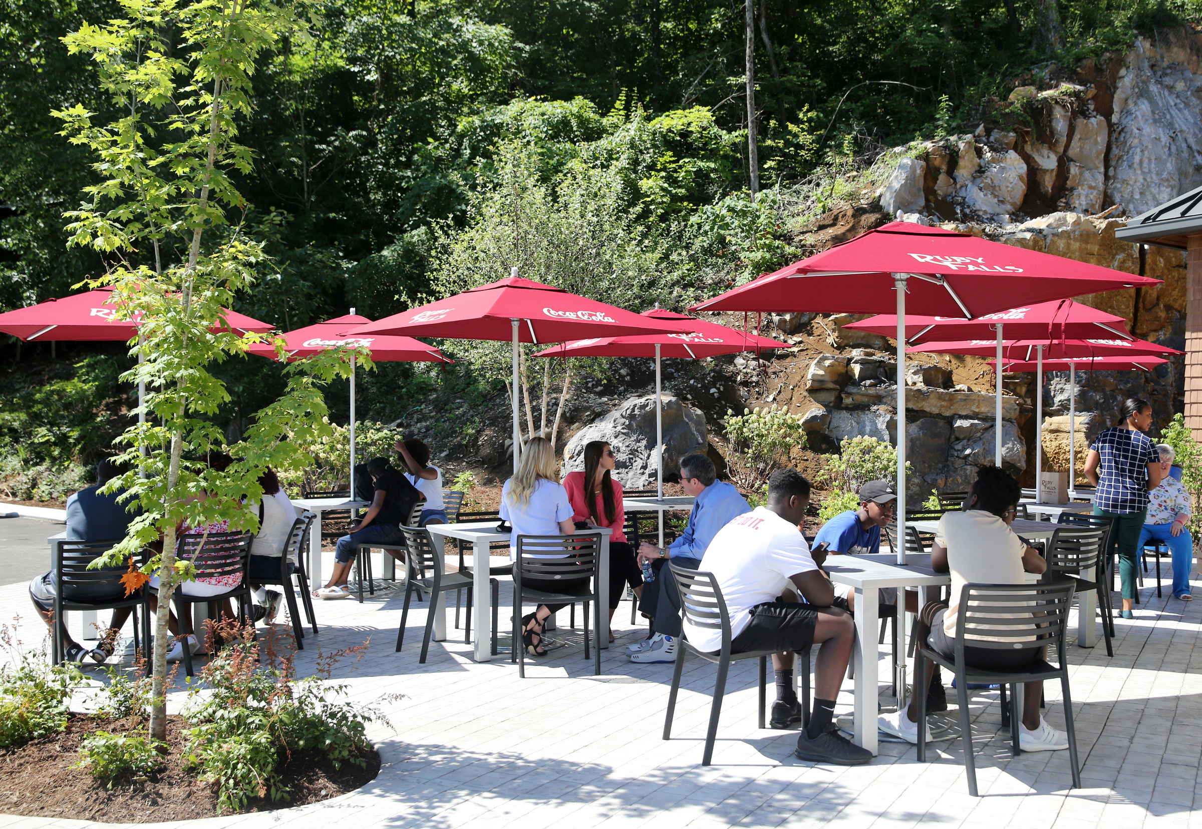 Guests sit under shaded picnic tables outside at Ruby Falls Friday, June 22, 2018 on Lookout Mountain in Tennessee. The shaded seating area was part of the first phase of the 10-year, $20 million expansion project Ruby Falls is undergoing.
