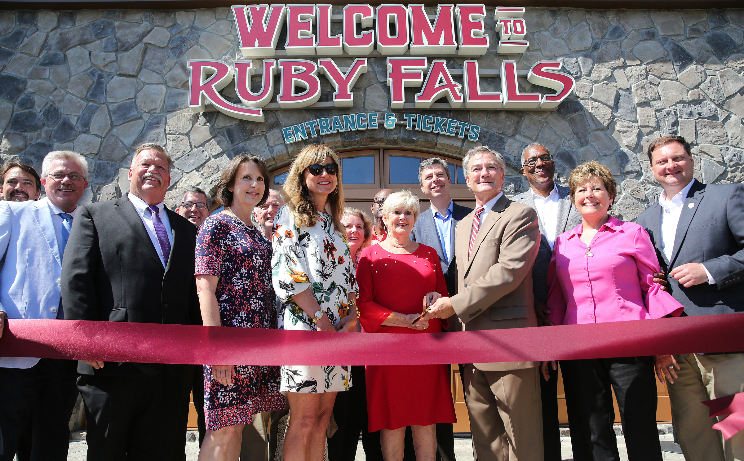 Chattanooga, Hamilton County, Ruby Falls and tourism officials pose for a ribbon cutting photo at Ruby Falls Friday, June 22, 2018 on Lookout Mountain in Tennessee. Friday marked the unveiling of the first phase of the 10-year, $20 million expansion Ruby Falls is undergoing.