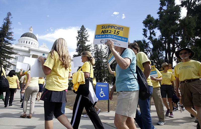 In this Sept. 24, 2015 file photo supporters of a measure to allow terminally ill people to end their own life march at the Capitol in Sacramento, Calif. California health officials say 374 terminally ill people took drugs to end their lives in 2017, the first full year after a law making the option legal took effect. They added, 577 people received aid-in-dying drugs in 2017, but not everyone used them. (AP Photo/Rich Pedroncelli, File)