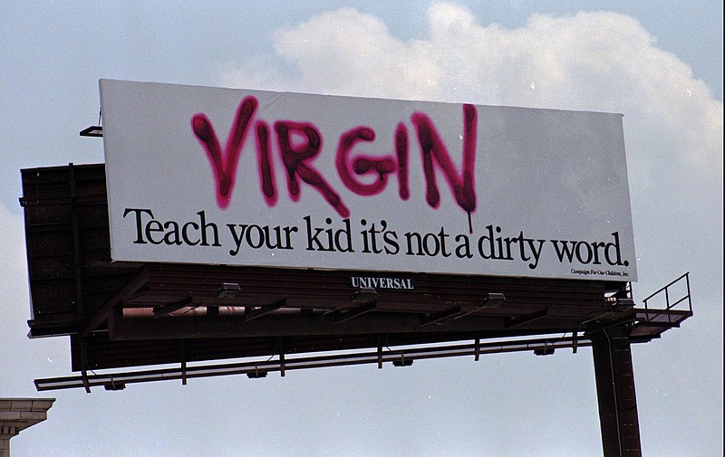 FILE - In this July 3, 1997, file photo, a billboard in downtown Baltimore displays a message of abstinence towards teen sex. 