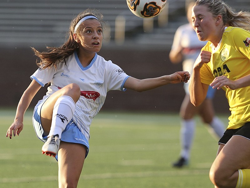 Chattanooga FC's Ruth Rosales, left, competes with Peachtree City MOBA's Katie Hickman for the ball during their match last Sunday at Finley Stadium. CFC is 5-0 this season and plays a road match against the Memphis Lobos tonight.