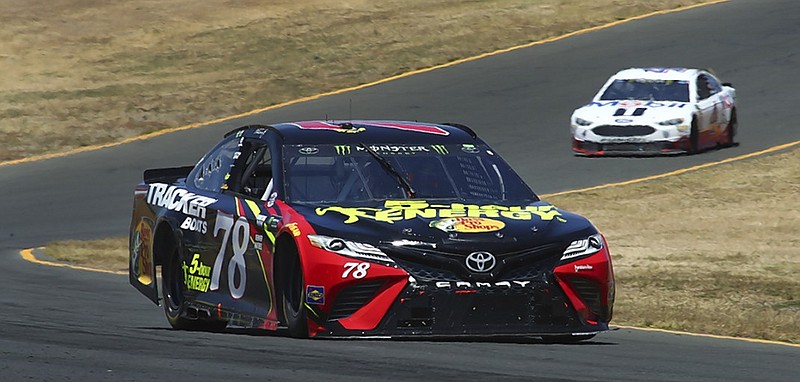 Martin Truex Jr. leads Kevin Harvick through a turn during Sunday's NASCAR Cup Series race at Sonoma Raceway in California.