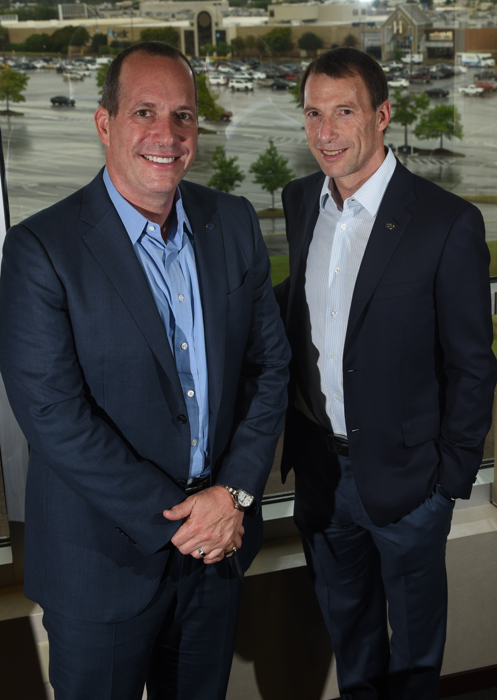 Staff photo by Tim Barber CBL Properties CEO Stephen Lebovitz, right, stands with recently named company president Michael Lebovitz Monday in the corporate headquarters adjacent to Hamilton Place mall.