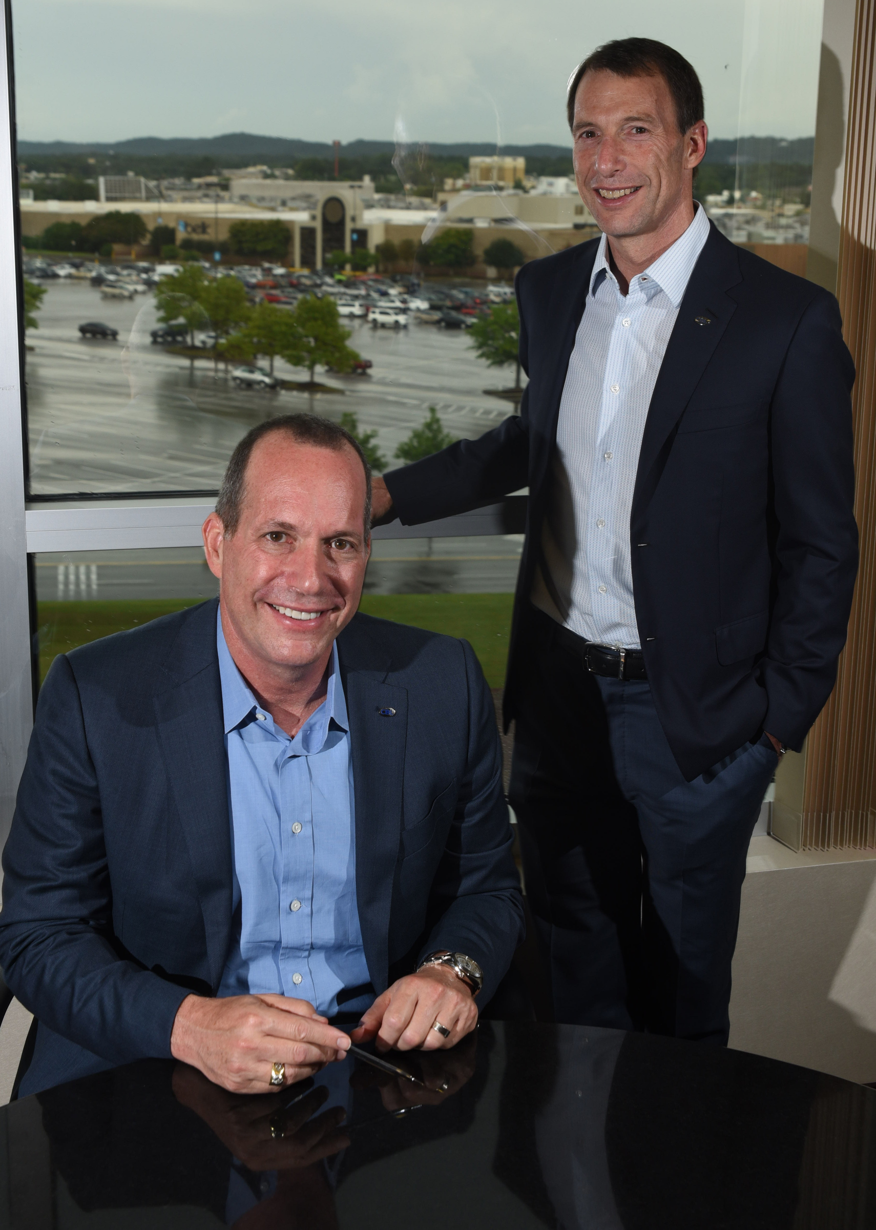 Staff photo by Tim Barber CBL Properties CEO Stephen Lebovitz, right, stands with recently named company president Michael Lebovitz Monday in the corporate headquarters adjacent to Hamilton Place mall.