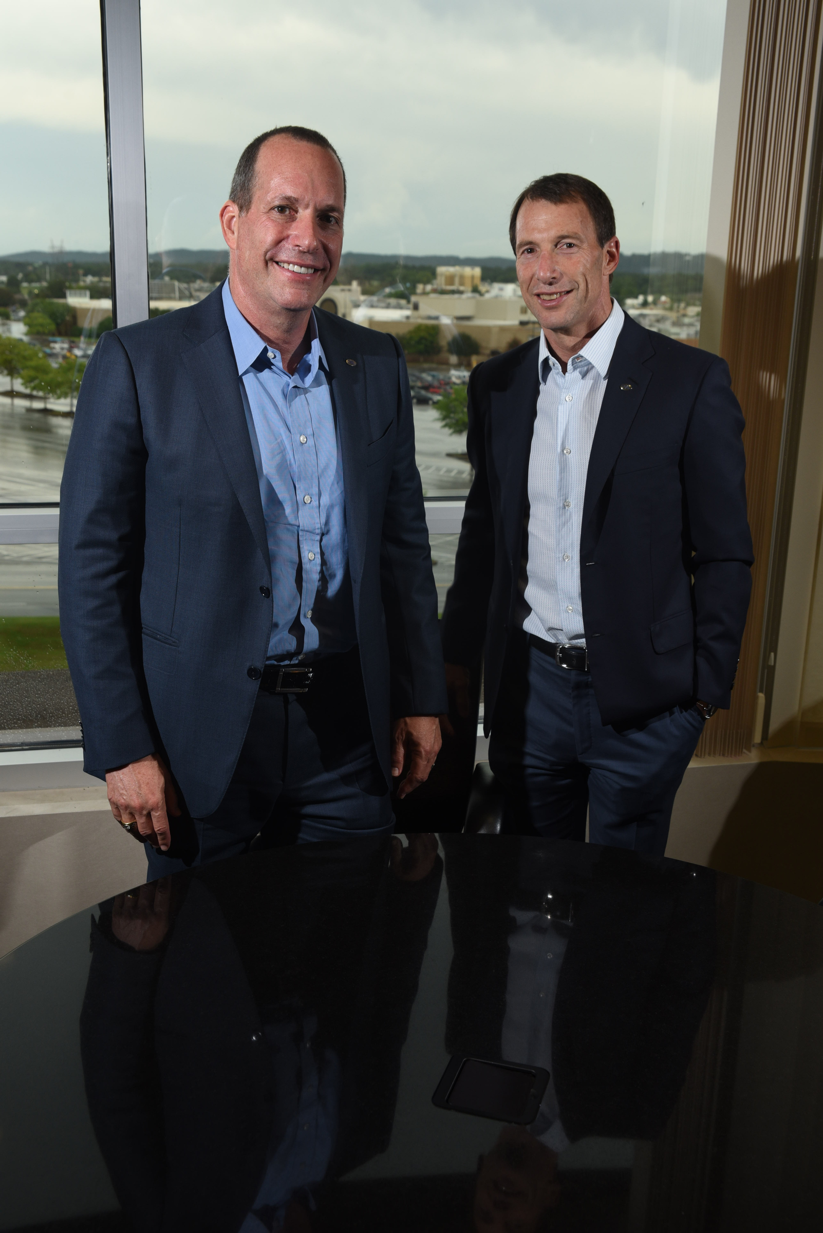 Staff photo by Tim Barber CBL Properties CEO Stephen Lebovitz, right, stands with recently named company president Michael Lebovitz Monday in the corporate headquarters adjacent to Hamilton Place mall.